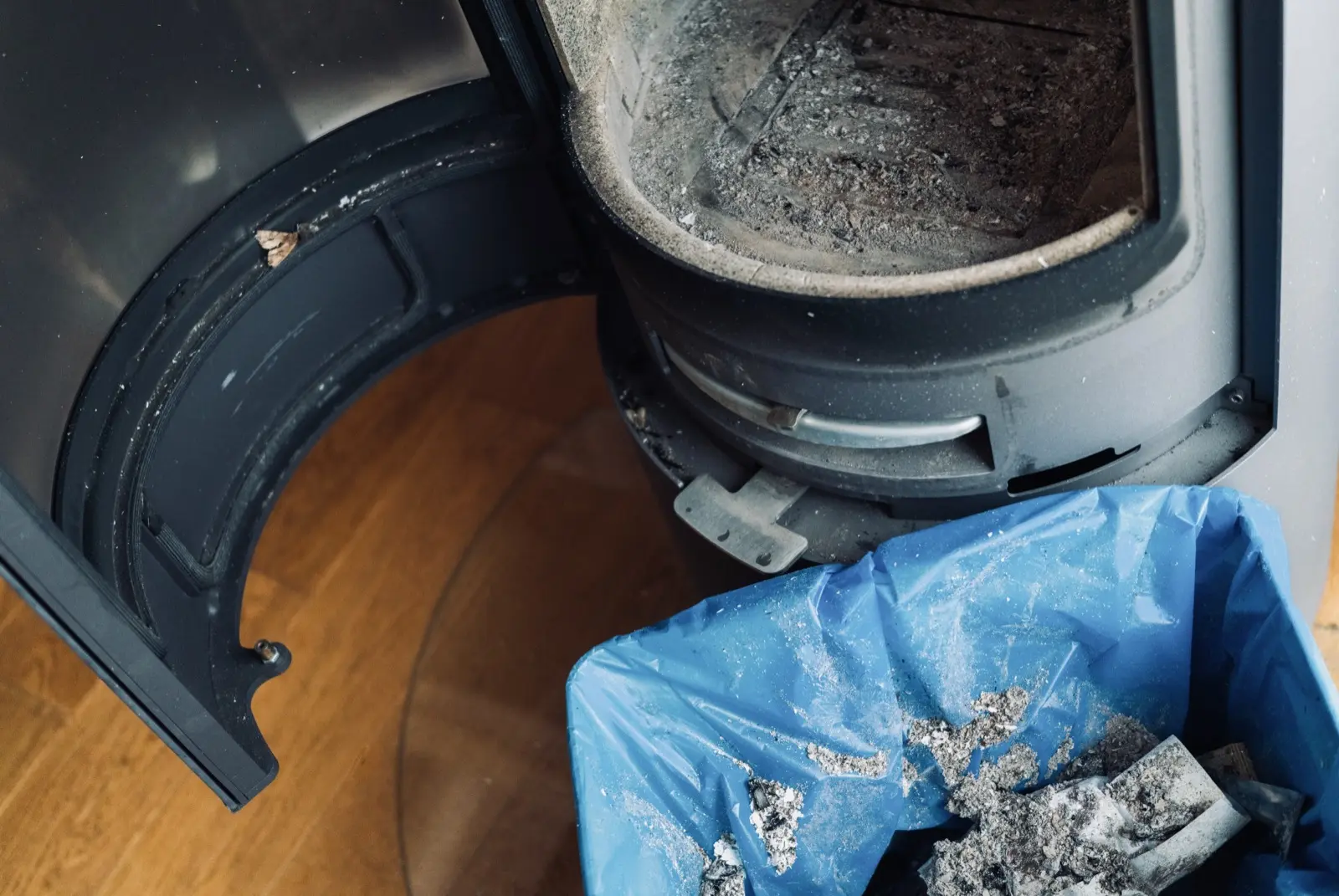 Technician servicing a wood stove in a Corner Brook home