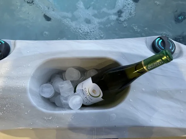 Built-in champagne bucket with bottle chilling on ice